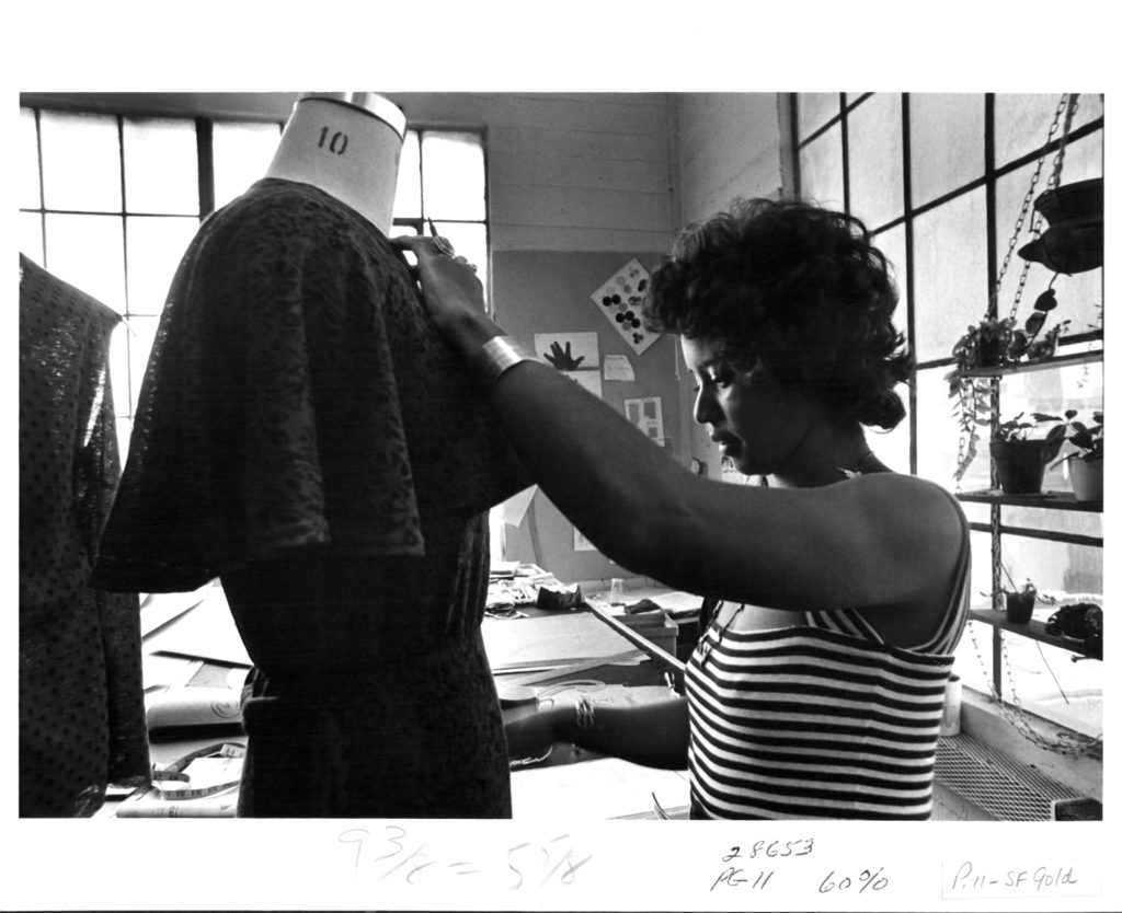 Black and white image of a seamstress in San Francisco Gold Co.