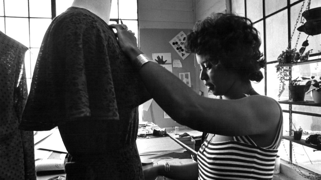 Black and white image of a seamstress in San Francisco Gold Co.