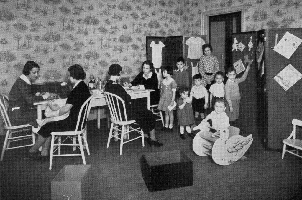 Mothers and children in the the Parents’ Conference Room at the East Harlem Health Center in 1934.