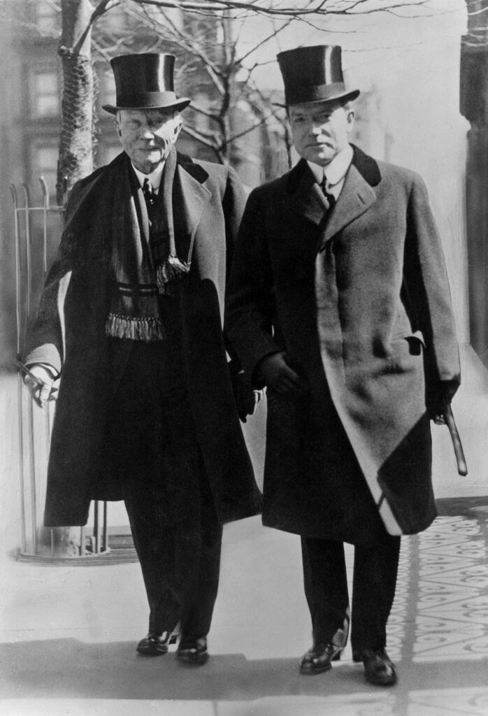 John D. Rockefeller, Jr., (left) as he left the Capitol in